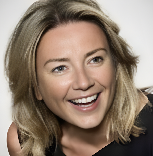 Smiling blonde woman with shoulder-length hair looking at the camera.